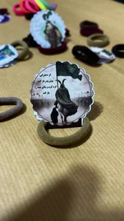 ۱۰ عدد گیفت کش مو دخترانه دایره طرح حضرت رقیه